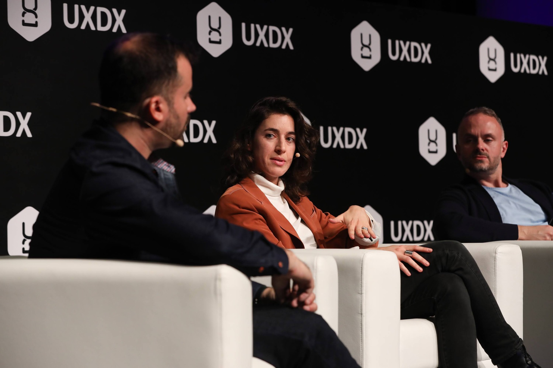 A speaker on the main stage at UXDX EMEA